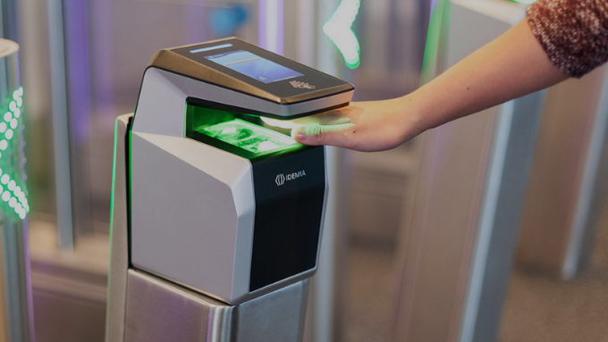 A smart security system with biometric scanning and AI firewalls glowing in a digital network.
